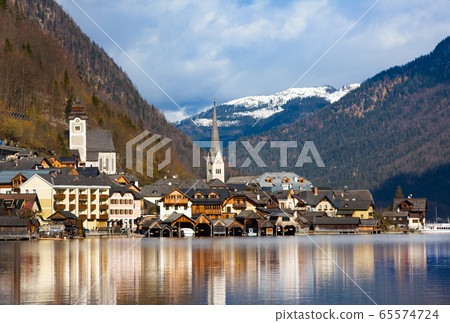 Hallstatt - UNESCO Heritage village against mountain and lake in winter. It`s most popular, romance and dream of destination Hallstatt - UNESCO Heritage village against mountain and lake in winter. It`s most popular, romance and dream of destination 65574724