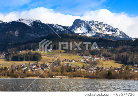 View idyllic Alpine mountains and lake Hallstattersee. Sunny winter morning in Austria View idyllic Alpine mountains and lake Hallstattersee. Sunny winter morning in Austria 65574726