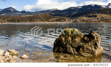 View idyllic Alpine mountains and lake Hallstattersee. Sunny winter morning in Austria View idyllic Alpine mountains and lake Hallstattersee. Sunny winter morning in Austria 65574727