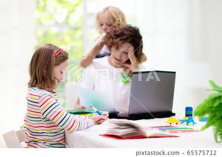 Mother working from home with kids. Quarantine. Mother working from home with kids. Quarantine. 65575712