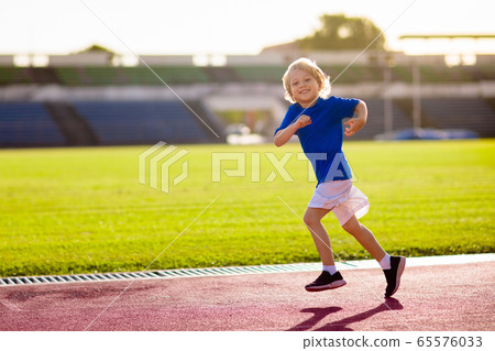 Child running in stadium. Kids run. Healthy sport. Child running in stadium. Kids run. Healthy sport. 65576033