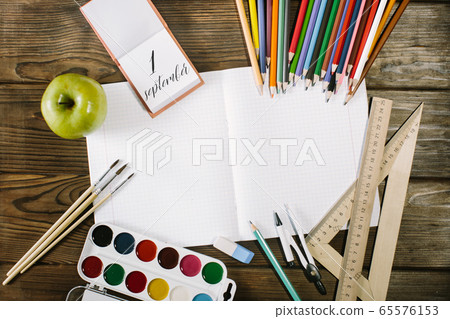 School supplies top corner border on a wooden desk background. first september School supplies top corner border on a wooden desk background. first september 65576153