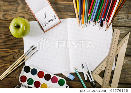 School supplies top corner border on a wooden desk background. first september School supplies top corner border on a wooden desk background. first september 65576156