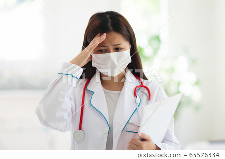 Doctor or nurse with stethoscope and face mask. Doctor or nurse with stethoscope and face mask. 65576334