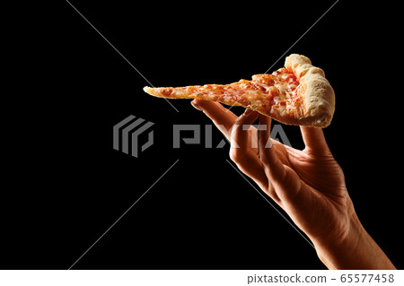 Hand holding slice of cheese pizza cut in slices Hand holding slice of cheese pizza cut in slices 65577458