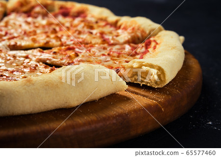 Cheese pizza cut in slices Cheese pizza cut in slices 65577460