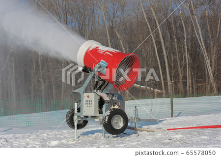 Snowmaking is the production of snow on ski 65578050