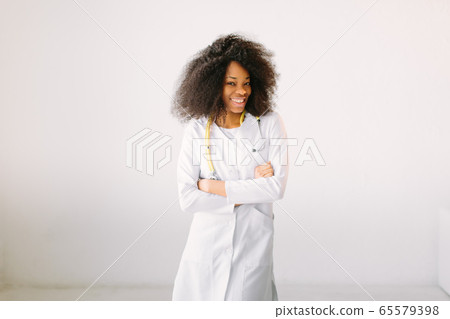 Black nurse isolated at the hospital. Happy African American trusted Doctor Woman isolated on white background Black nurse isolated at the hospital. Happy African American trusted Doctor Woman isolated on white background 65579398