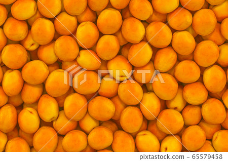 Background from apricots, top view. 3D rendering Background from apricots, top view. 3D rendering 65579458