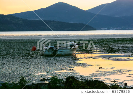 Fishing boat with a motor on Lake Orestiada in 65579836