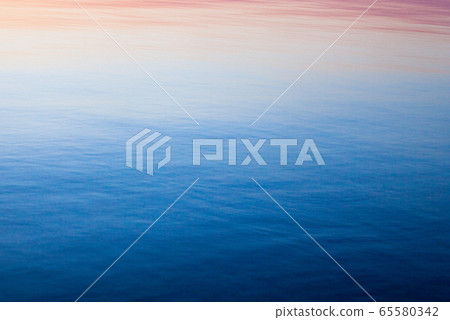 Water surface at sunset. Water surface at sunset. 65580342