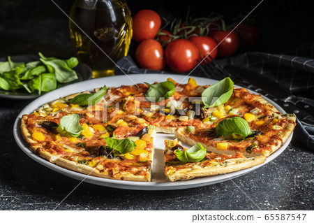 Tasty salami pizza. 65587547