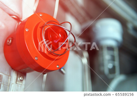 Red warning light of an emergency beacon at an Red warning light of an emergency beacon at an 65589156