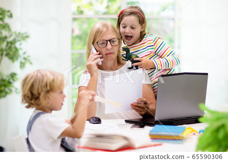 Mother working from home with kids. Quarantine. Mother working from home with kids. Quarantine. 65590306