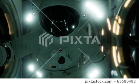 8K astronaut inside the orbital space station 65590498