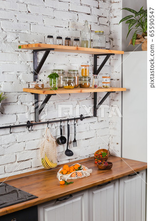 interior of modern kitchen white brick wall zero waste concept glass jars mesh reuse bag interior of modern kitchen white brick wall zero waste concept glass jars mesh reuse bag 65590547
