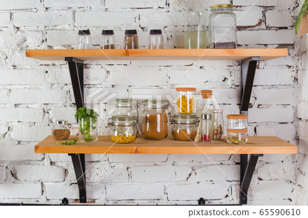 interior of modern kitchen white brick wall zero waste concept glass jars mesh reuse bag 65590610