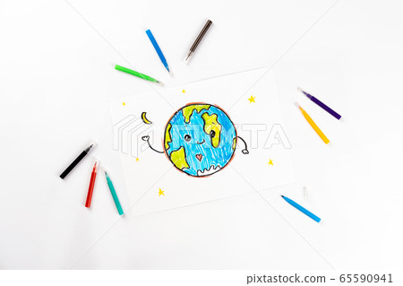 Children's drawing of our planet on a white sheet of paper. 65590941