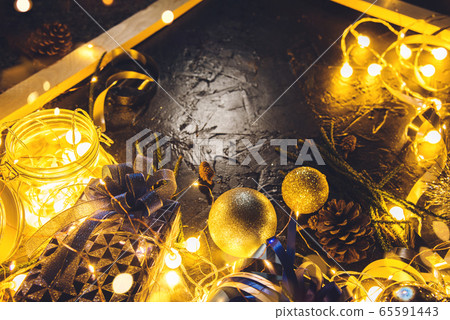 Christmas gift with blue ribbon and Christmas decoration balls on abstract bokeh black background  65591443