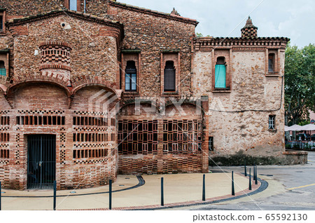 Red brick vintage building of Ca l'Ordal in La Colonia Guell in Barcelona Red brick vintage building of Ca l'Ordal in La Colonia Guell in Barcelona 65592130