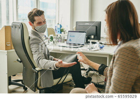 Using sanitizer in office Using sanitizer in office 65595029