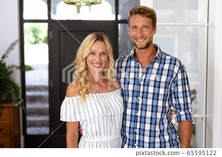 Portrait of Caucasian couple enjoying their time at the house 65595122