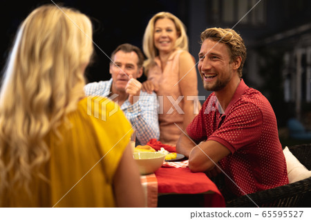Multi-generation Caucasian family during a dinner 65595527