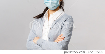Covid19, virus, health and medicine concept. Portrait of young confident professional asian nurse, taking care of patients, wearing medical mask during quarantine coronavirus, cross hands chest Covid19, virus, health and medicine concept. Portrait of young confident professional asian nurse, taking care of patients, wearing medical mask during quarantine coronavirus, cross hands chest 65598546