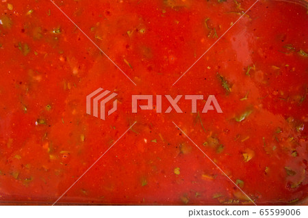 Closeup texture red tomato sauce with herbs Closeup texture red tomato sauce with herbs 65599006