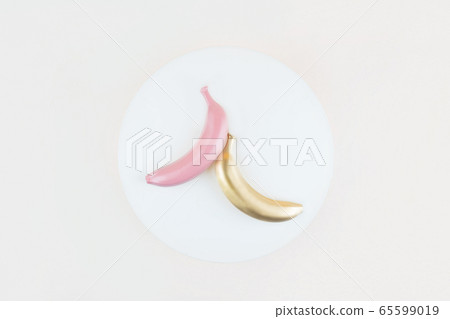 Three bananas on a background. Three bananas on a background. 65599019