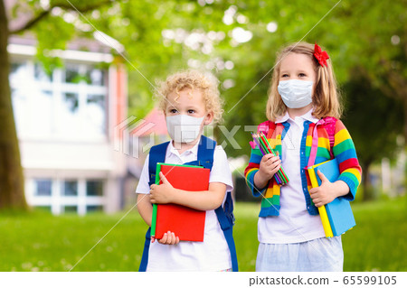 Kids on first school day after quarantine. 65599105