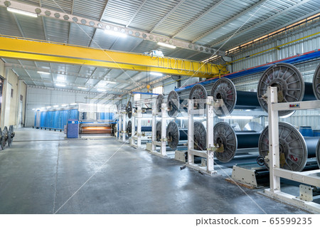 Interior of Textile factory with automated machinery.Concept of Industry and Technology. 65599235