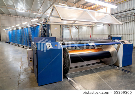 Interior of Textile factory with automated machinery.Concept of Industry and Technology. 65599560
