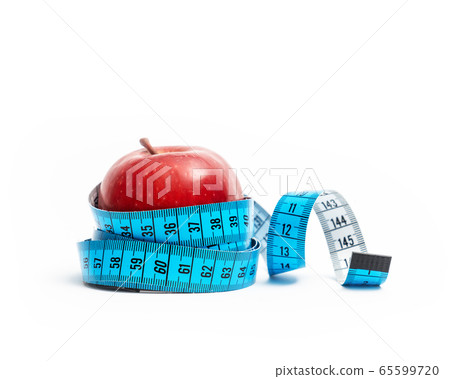 isolated red apple wrapped with tape measuring on white background. Diet and healthy living concept. 65599720