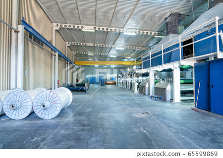 Interior of Textile factory with automated machinery.Concept of Industry and Technology. 65599869