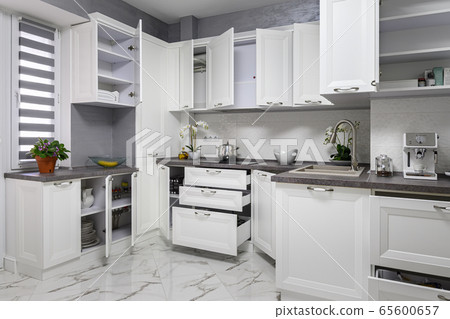 Minimalistic modern white kitchen interior details Minimalistic modern white kitchen interior details 65600657