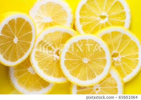 Background from bright juicy sliced lemon slices. 65601064