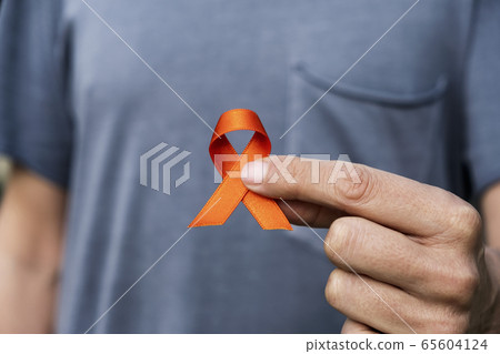 orange ribbon in support of multiple sclerosis 65604124