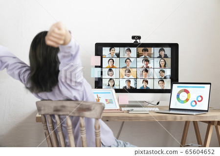 Image of a young woman online meeting web conference growing in front of a personal computer 65604652