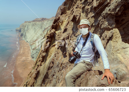 Tourist in medical disposable mask in Iran. Tourist in medical disposable mask in Iran. 65606723