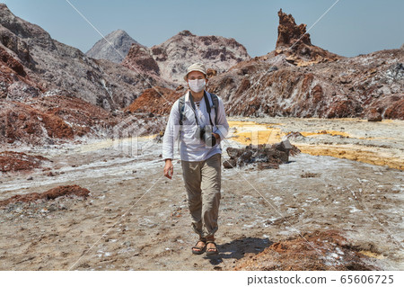 Traveller in medical individual mask in Iran. Traveller in medical individual mask in Iran. 65606725