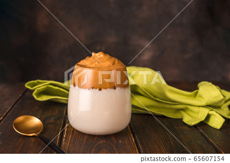 A glass with famous whipped instant coffee Dalgona 65607154