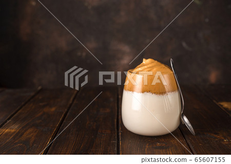 Dalgona coffee, a whipped trendy instant coffee Dalgona coffee, a whipped trendy instant coffee 65607155