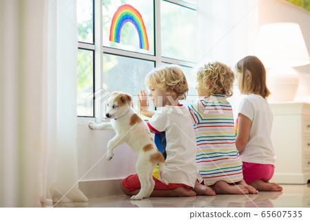 Coronavirus quarantine. Kids at window. Stay home. Coronavirus quarantine. Kids at window. Stay home. 65607535