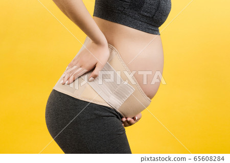 Cropped image of pregnancy belt dressed on Cropped image of pregnancy belt dressed on 65608284