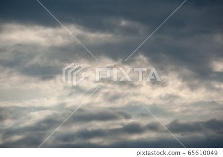 Natural sky composition. Dark ominous grey storm rain clouds. Dramatic sky. Overcast stormy cloudscape. Thunderstorm. Element of apocalypse design. Natural sky composition. Dark ominous grey storm rain clouds. Dramatic sky. Overcast stormy cloudscape. Thunderstorm. Element of apocalypse design. 65610049