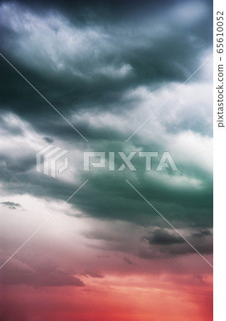 Natural sky composition. Dark ominous colorful storm rain clouds. Dramatic sky. Overcast stormy cloudscape. Thunderstorm. Element of apocalypse design. Toned. 65610052