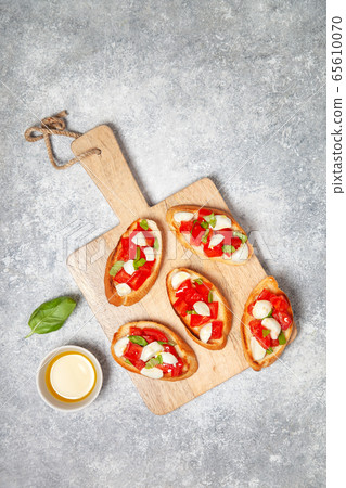 bruschetta with tomatoes and mozzarella bruschetta with tomatoes and mozzarella 65610070