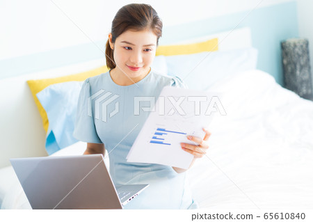 Beautiful woman, working at home Beautiful woman, working at home 65610840