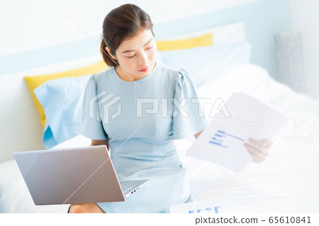 Beautiful woman, working at home 65610841